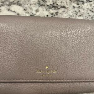 Kate Spade beige tri-fold wallet.